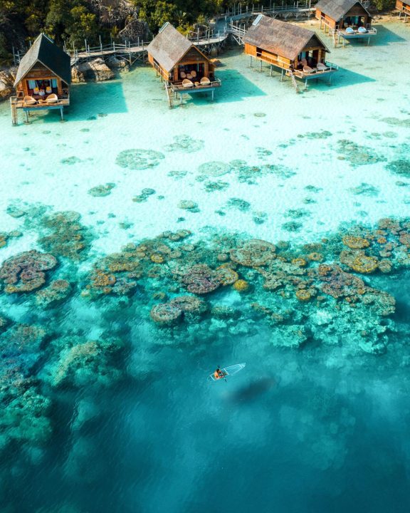Overwater villas overlooking coral reefs